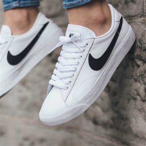 nike white shoes black swoosh.